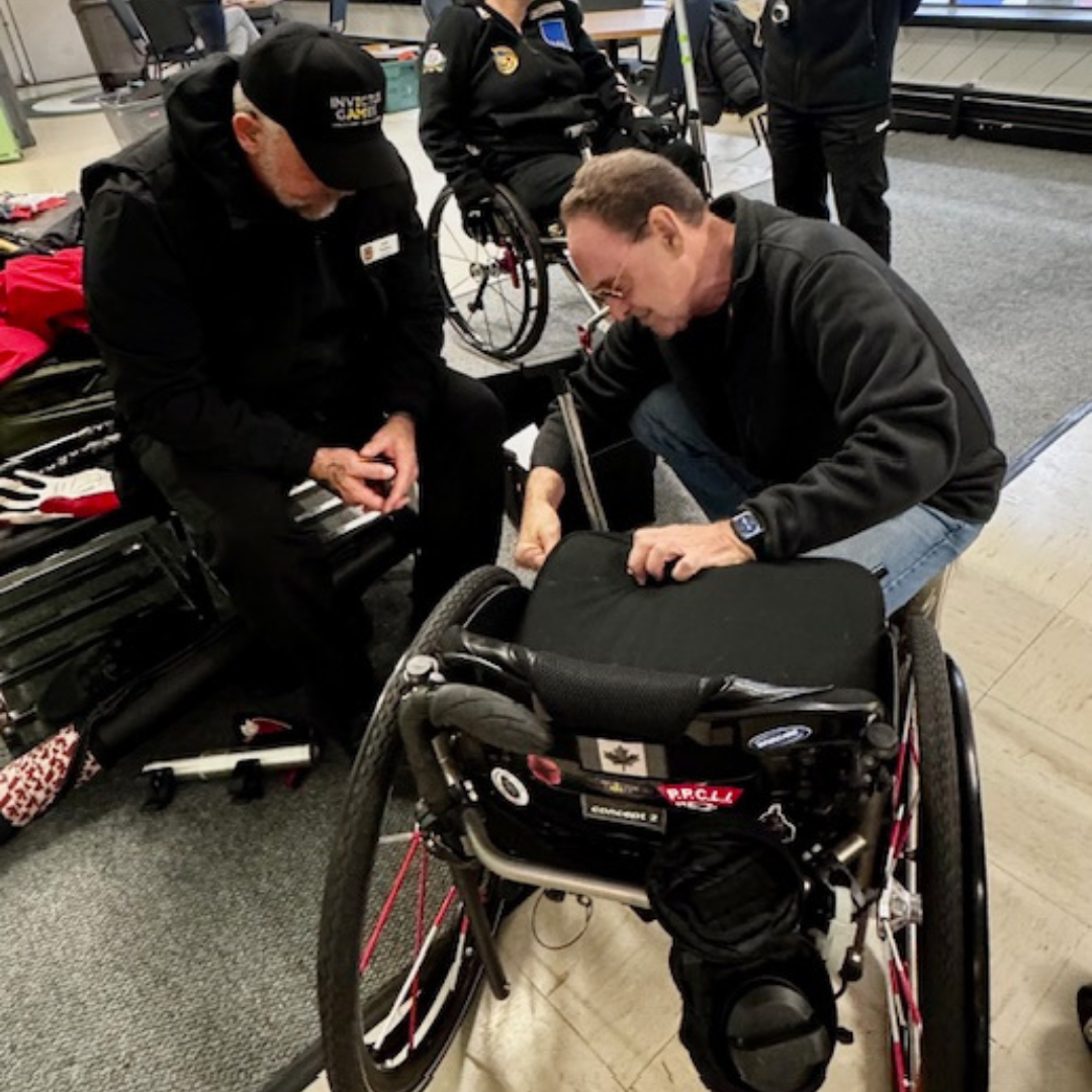 Robin attaching a balance pole for a curling client